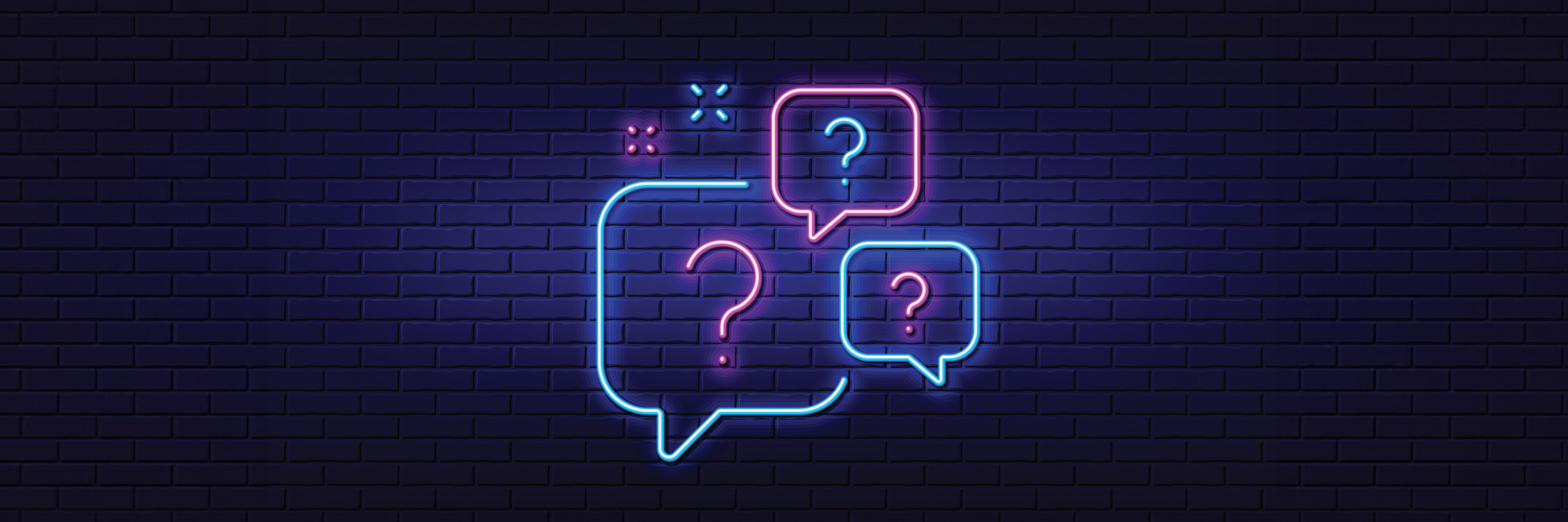 Neon question marks illuminating a dark blue wall