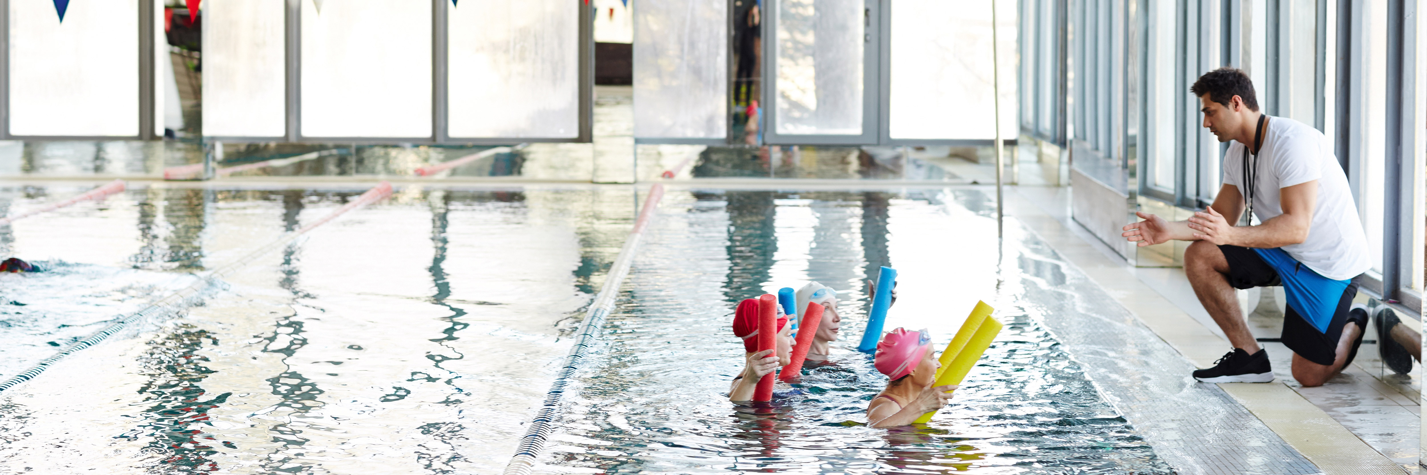 an instructor taking a water aerobics lesson