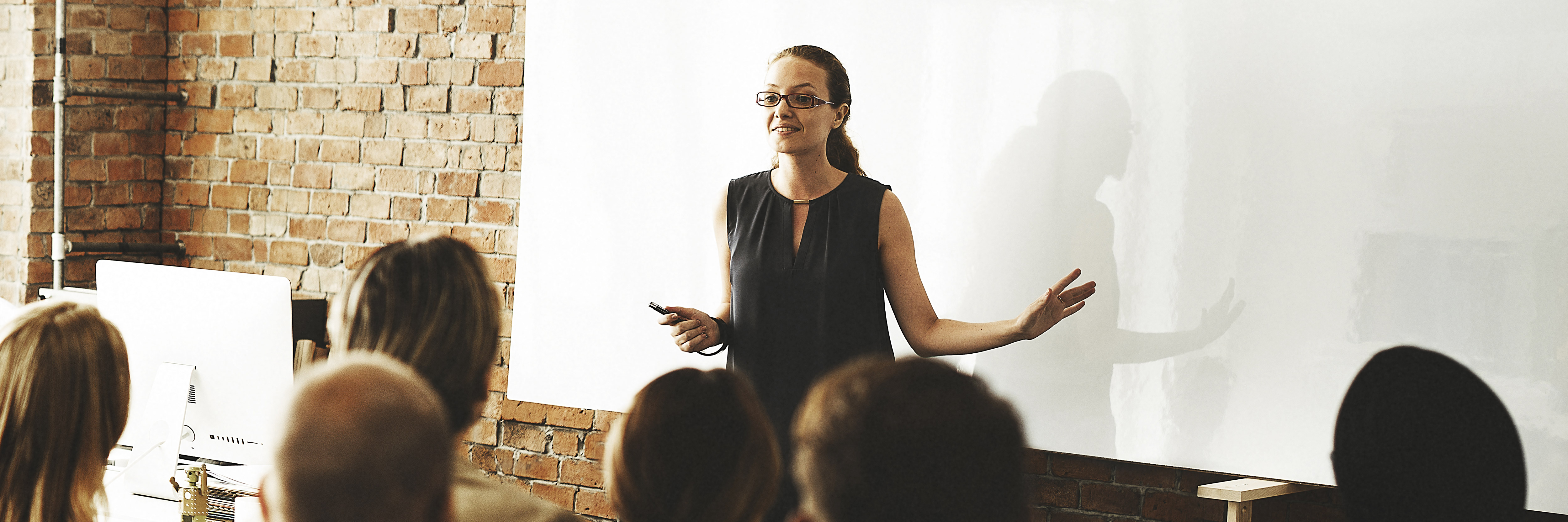 a female trainer teaching a group of learners